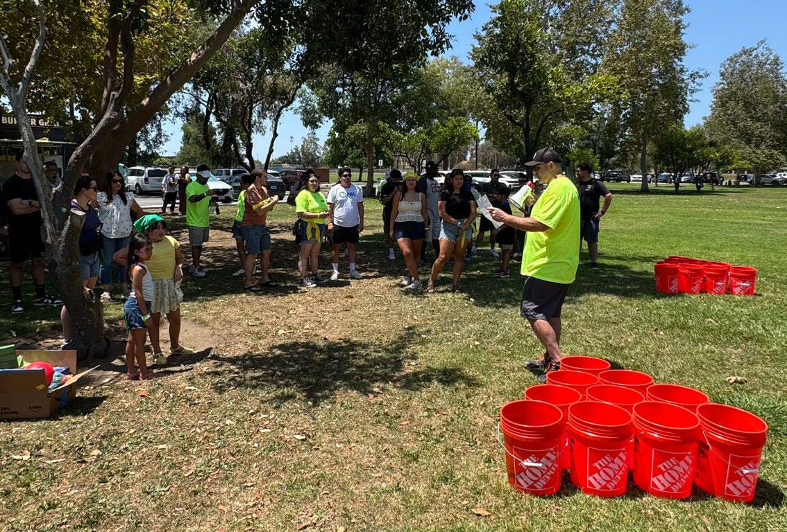 ISYS® team members participate in the Summer Olympics field games during the 2026 company picnic.